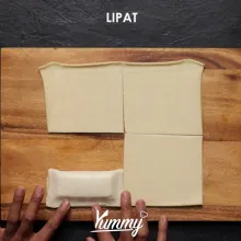 Oleskan putih telur di bagian pinggir kulit puff. Lipat kulit puff ...