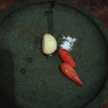 Bawang putih dan cabai di goreng dahulu kemudian ulek halus tambah garam.