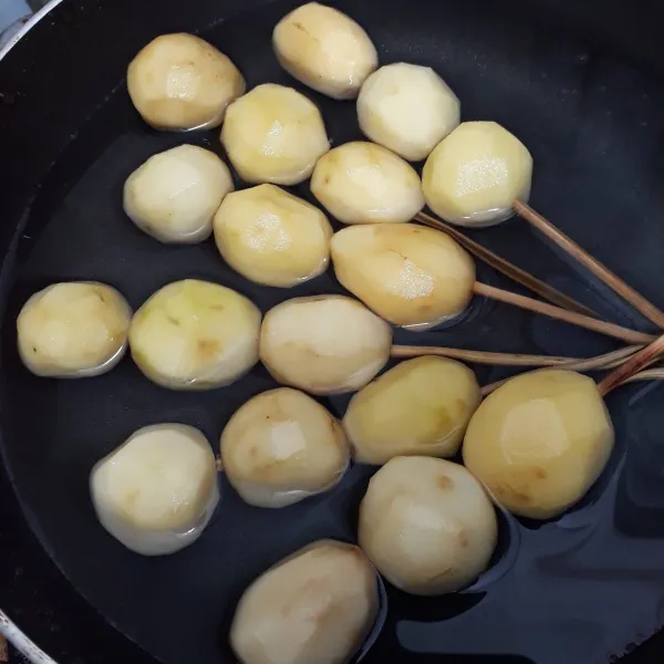 Rebus tusukan kentang hingga setengah matang