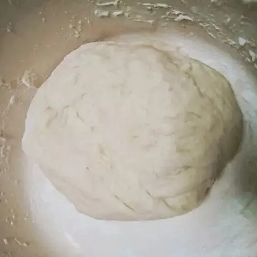 Aduk rata adonan menggunakan tangan sampai kalis dan licin. Tambahkan soft butter dan garam lalu aduk rata kembali.