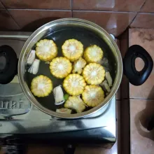 Setelah tetelan empuk, masukkan jagung manis dan nangka muda, masak hingga empuk.