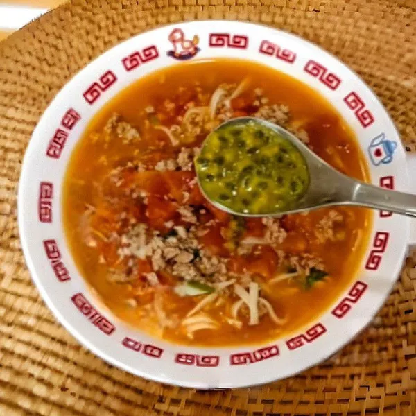 Angkat, lalu tuangkan ke dalam mangkuk dan beri daging buah markisa beserta dengan taburan daun ketumbar.